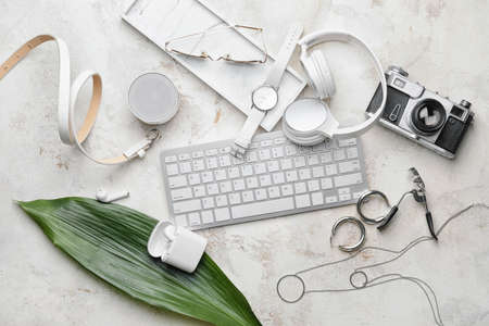 Stylish composition with wristwatch, gadgets and accessories on light backgroundの写真素材