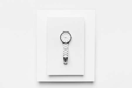 Stylish wristwatch on white background
