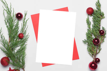 Beautiful Christmas decorations with empty card on white backgroundの写真素材