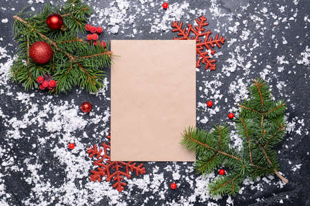 Beautiful Christmas decorations and empty card on dark background