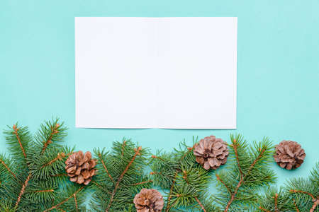 Beautiful Christmas decorations with empty card on color backgroundの写真素材