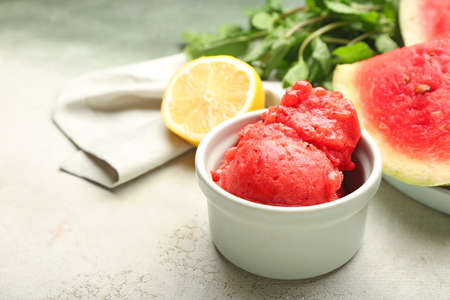 Bowl with watermelon ice cream on light backgroundの写真素材