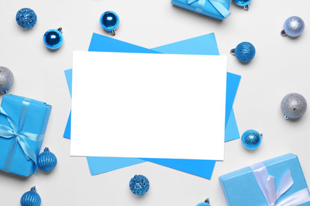 Beautiful Christmas decorations with empty card on white backgroundの写真素材