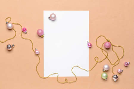 Beautiful Christmas decorations with empty card on color backgroundの写真素材