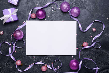 Beautiful Christmas decorations and empty card on dark backgroundの写真素材