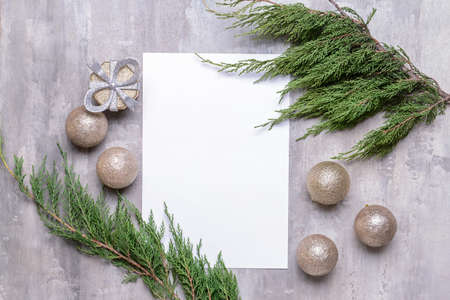 Beautiful Christmas decorations with empty card on gray backgroundの写真素材