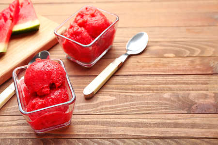 Bowls with watermelon ice cream on wooden backgroundの写真素材