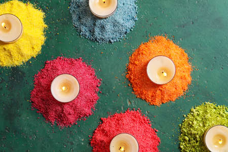 Festive composition with burning candles for celebration of Divaly on color backgroundの写真素材