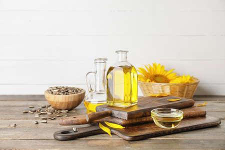 Composition with sunflower oil on wooden backgroundの写真素材
