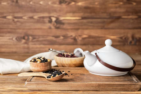 Composition with dry fruit tea on wooden background