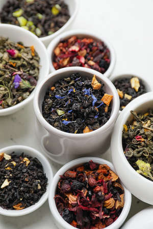 Bowls with dry fruit tea on light backgroundの写真素材