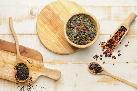 Composition with dry fruit tea on wooden background