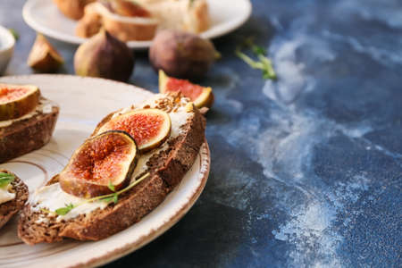 Tasty sandwiches with fig on color backgroundの写真素材