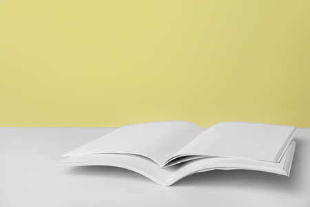 Open blank magazines on table