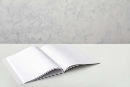 Open blank magazine on tableの写真素材