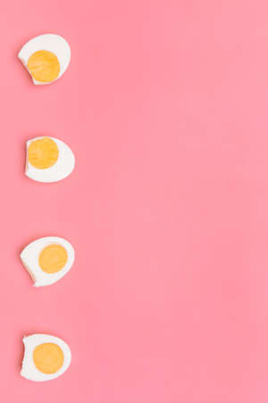 Tasty boiled eggs on color backgroundの写真素材