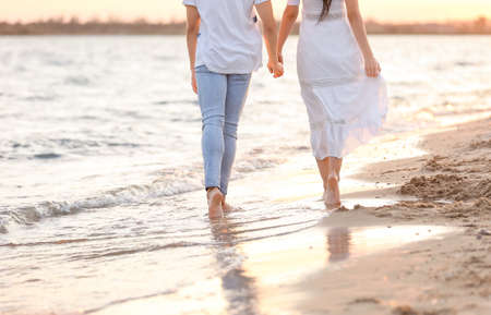 Happy young couple on sea beachの写真素材