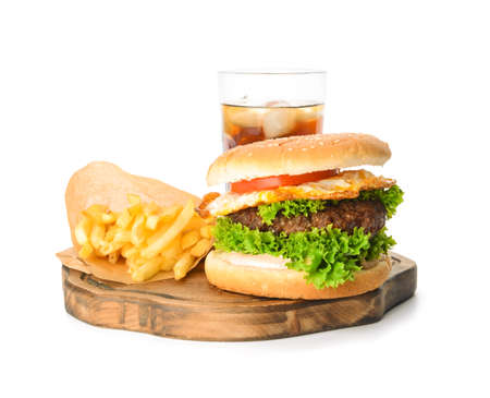 Board with tasty burger, french fries and cola drink on white backgroundの写真素材