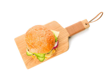 Wooden board with tasty burger on white background