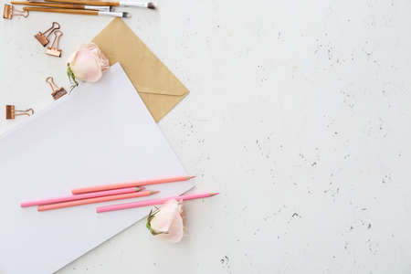 Composition with blank magazine and stationary on light backgroundの写真素材