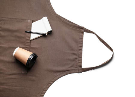 Apron, paper cup, notebook and pen on white backgroundの写真素材