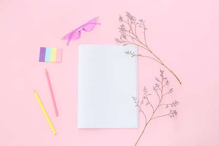 Composition with blank magazine, sunglasses and pencils on color backgroundの写真素材