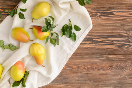 Composition with fresh pears on wooden backgroundの写真素材