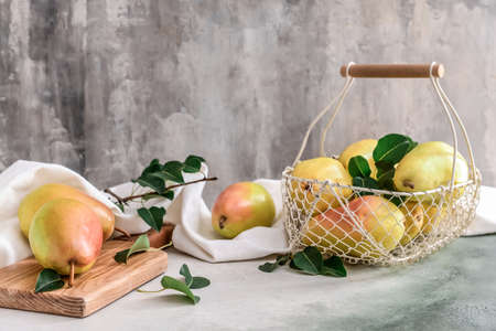 Composition with fresh pears on grunge backgroundの写真素材