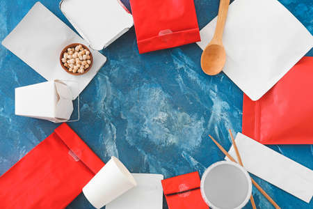 Frame made of packages for food on color backgroundの写真素材