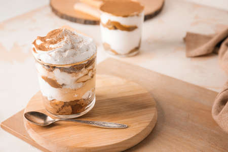 Sweet tasty tiramisu on tableの写真素材