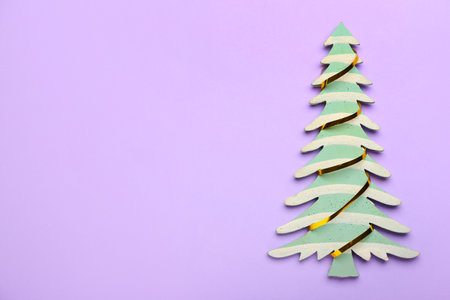 Beautiful Christmas tree on color backgroundの写真素材