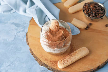 Sweet tasty tiramisu on table