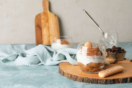 Sweet tasty tiramisu on table