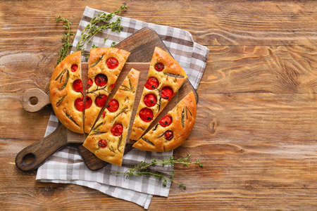 Composition with traditional Italian focaccia on wooden backgroundの写真素材
