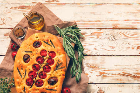 Composition with traditional Italian focaccia on wooden backgroundの写真素材