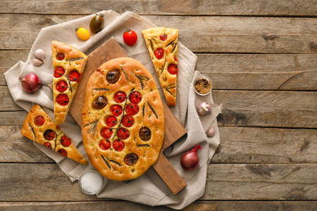 Composition with traditional Italian focaccia on wooden backgroundの写真素材