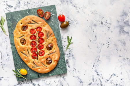 Composition with traditional Italian focaccia on light backgroundの写真素材