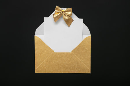 Beautiful envelope and empty paper sheet on dark backgroundの写真素材