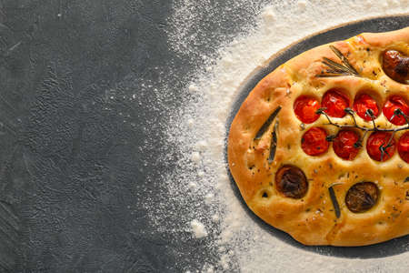 Traditional Italian focaccia on dark backgroundの写真素材