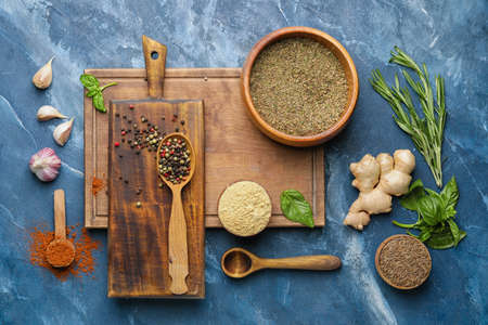 Composition with different spices and herbs on color backgroundの写真素材