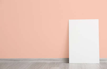 Blank poster near color wall