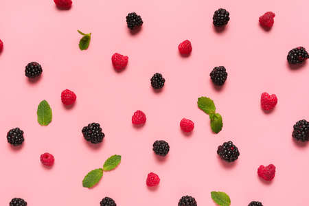Different ripe berries on color backgroundの写真素材