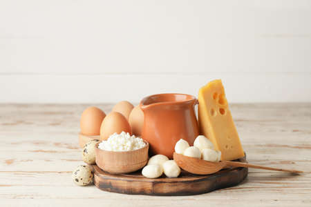 Different dairy products on wooden backgroundの写真素材