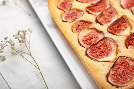 Tray with delicious fig pie on tableの写真素材