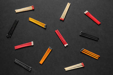 Different matches on dark backgroundの写真素材