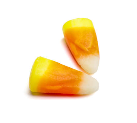 Tasty candies for Halloween on white background