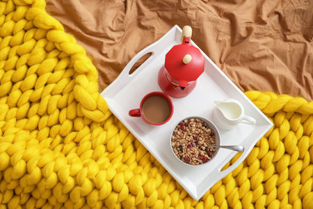 Tray with tasty breakfast on bed, top viewの写真素材