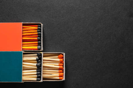 Different boxes with matches on dark backgroundの写真素材