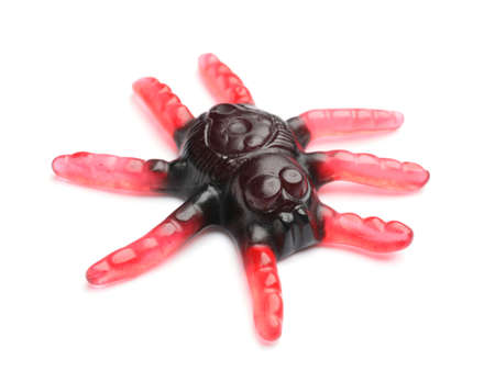 Tasty scary candy for Halloween on white background