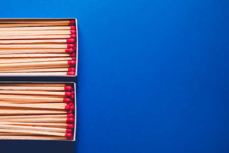 Boxes with matches on color backgroundの写真素材